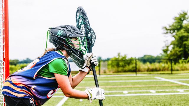 Image of youth lacrosse goalie at Goaliesmith clinic awaiting a shot on goal