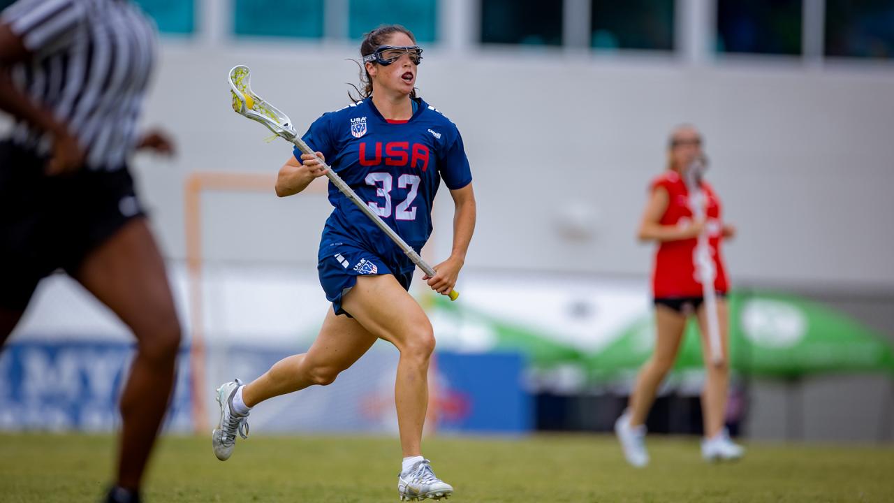 Sydney Scales runs up the field with the ball