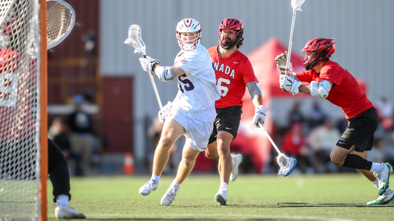 CJ Kirst of USA operates inside a pair of Canadian defenders going to goal at the World Lacrosse Super Sixes event in Oshawa, Ontario.