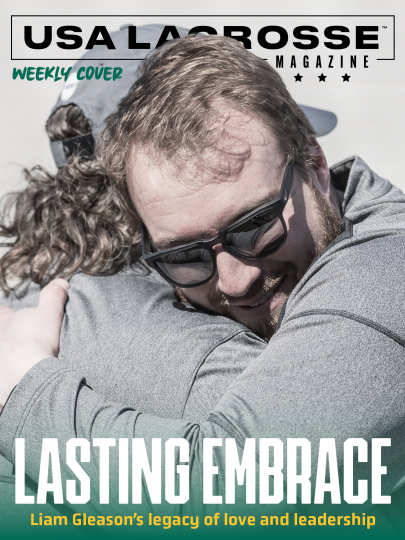 Liam Gleason hugs his coach and mentor, Scott Marr, after a college men's lacrosse game in 2018. USA Lacrosse Magazine Weekly Cover with the headline, "Lasting Embrace: Liam Gleason's Legacy of Love and Leadership"