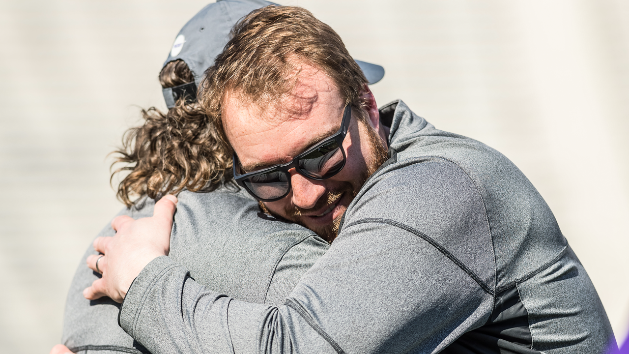 Liam Gleason hugs his coach and mentor, Scott Marr, after a college men's lacrosse game in 2018